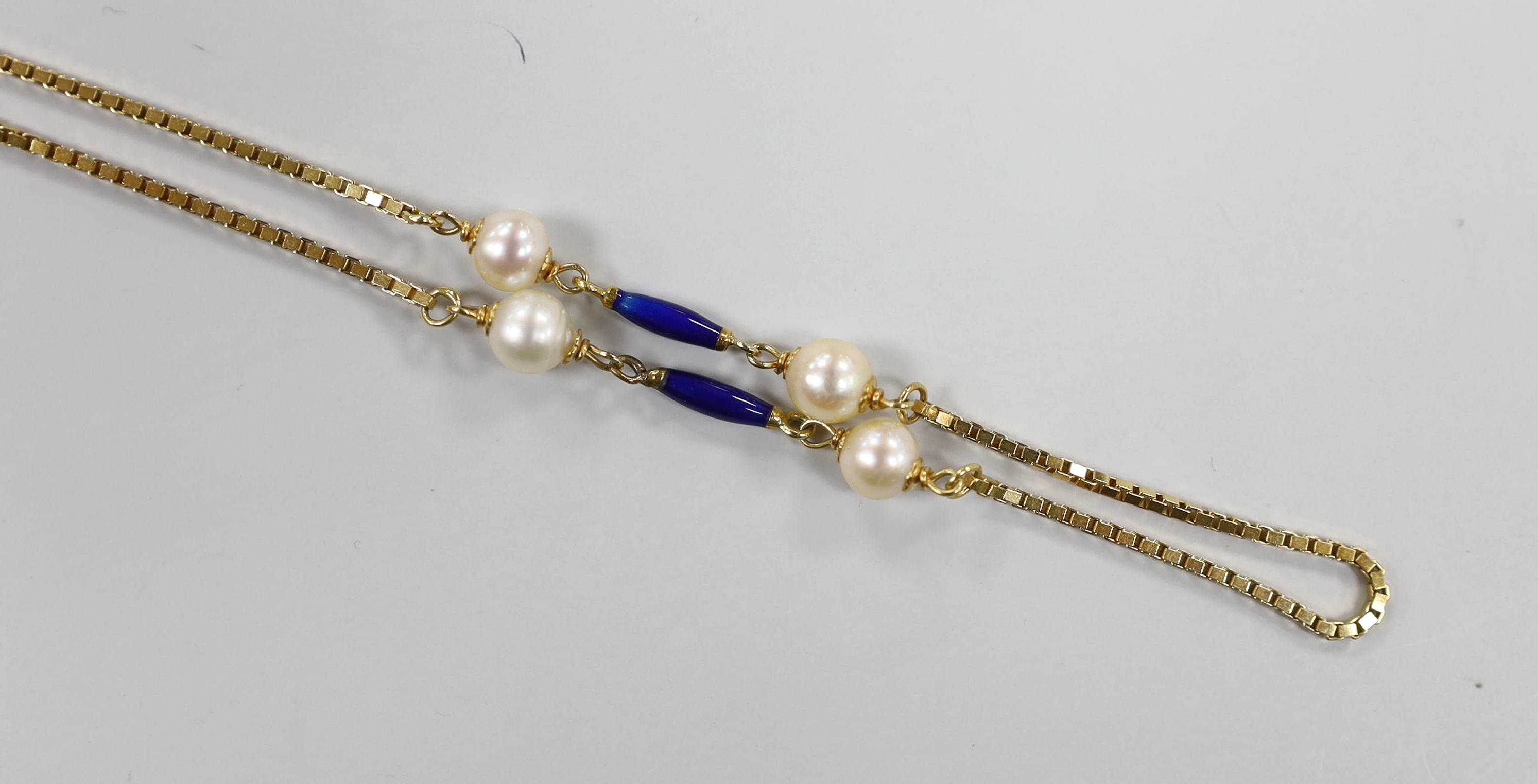 A mid to late 20th century Italian Uno-A-Erre 750 yellow metal, cultured pearl and blue enamelled baton link necklace, 94cm, gross weight 23.5 grams.